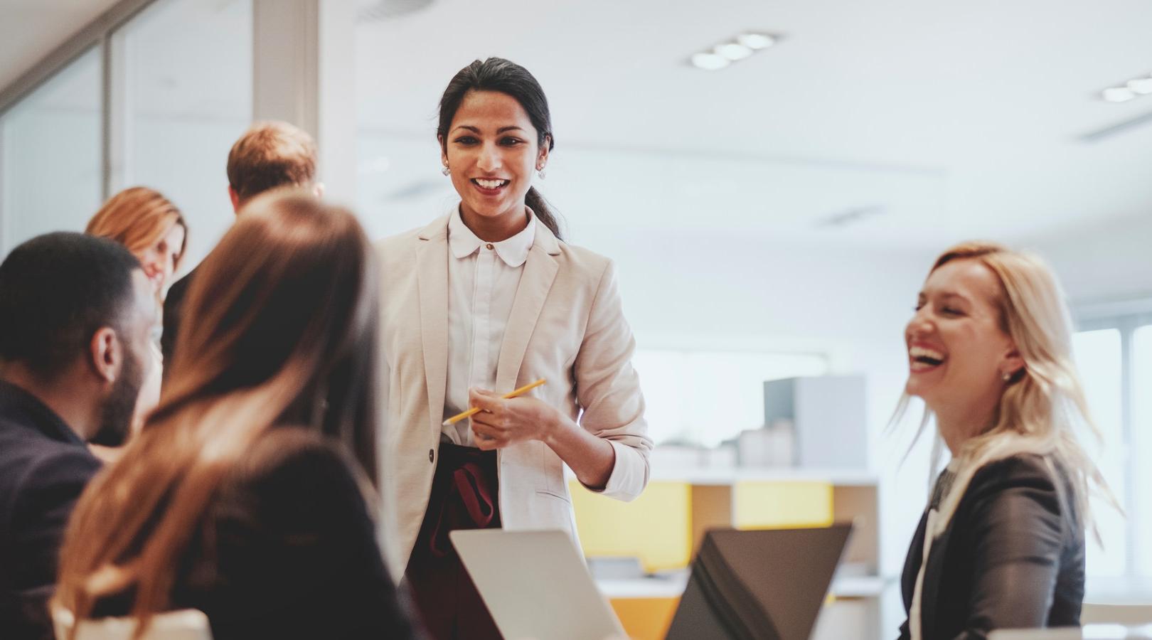 Smiling mature businessman during meeting in modern office